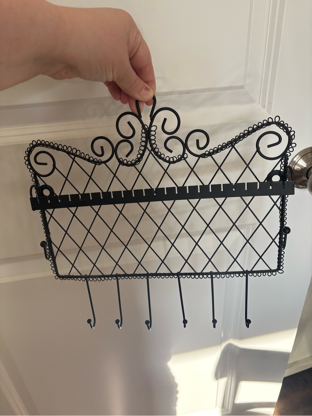 Black Decorative Metal Wall Hook Rack - Elegant Scroll Design. Jewelry holder
